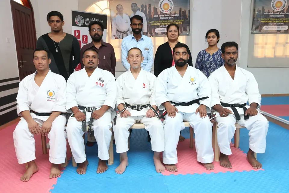 Chi Club instructors seated together in the dojo