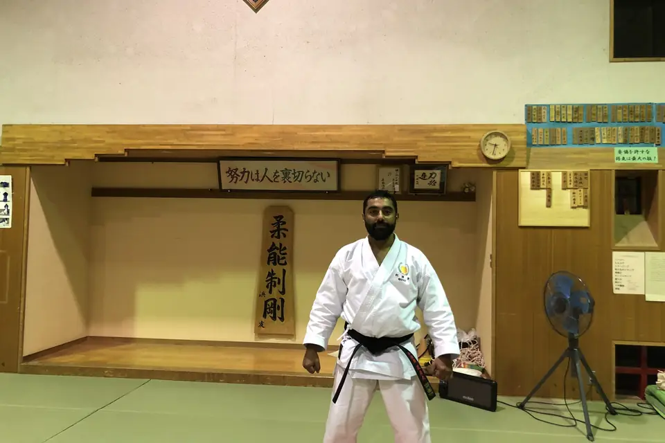 Sensei Najmal standing in a traditional Japanese dojo