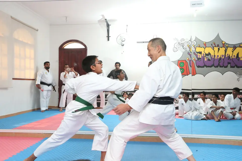 Sensei demonstrating a self-defence technique with a student in Doha
